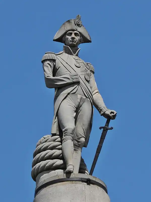 Statue of Admiral Lord Nelson wearing a bicorne hat atop Nelson's Column in Trafalgar Square, London