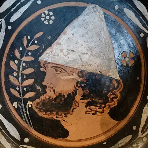 The Complete History of Hats: How Headwear Shaped Fashion and Culture Through the Ages 4 Ancient Greek red-figure depiction of a conical pileus hat, dating to the 4th century BC, from the Louvre Museum collection.