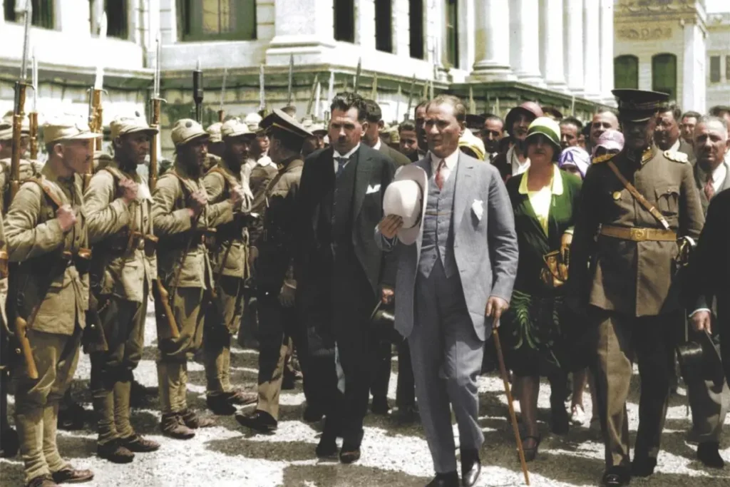 Mustafa Kemal Atatürk wearing a Panama-style hat during the 1925 Hat Reform in Turkey, symbolizing modernization and Western-style attire.