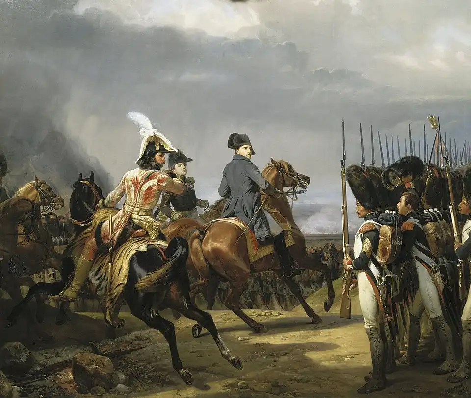 The Complete History of Hats: How Headwear Shaped Fashion and Culture Through the Ages 12 Painting of Napoleon Bonaparte wearing his iconic sideways bicorne hat during the Battle of Jena, 1836 oil painting by Horace Vernet, Château de Versailles, France.