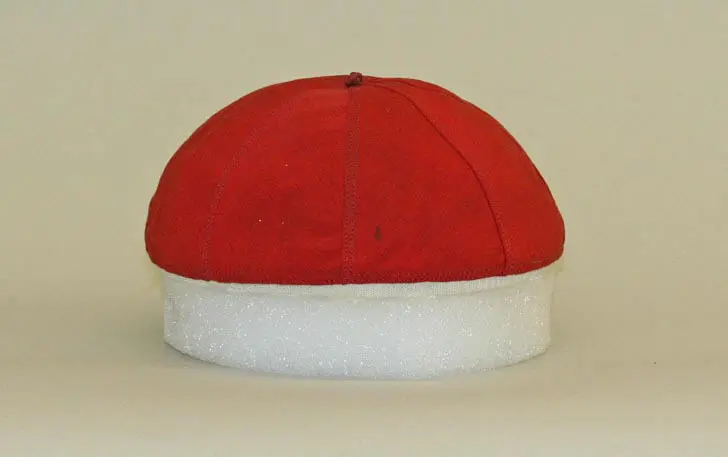 The Complete History of Hats: How Headwear Shaped Fashion and Culture Through the Ages 5 A red zucchetto hat from the 13th century, a small brimless skullcap traditionally worn by Catholic clergy.