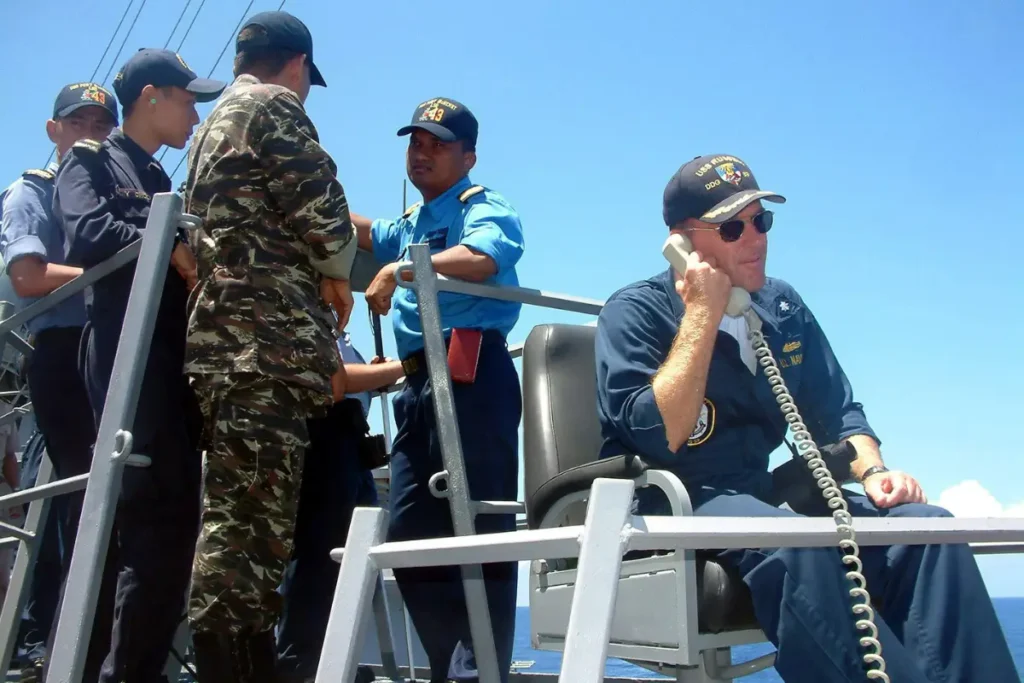 U.S. Navy commander on USS Russell in 2004 wearing a baseball-style command cap as part of the uniform