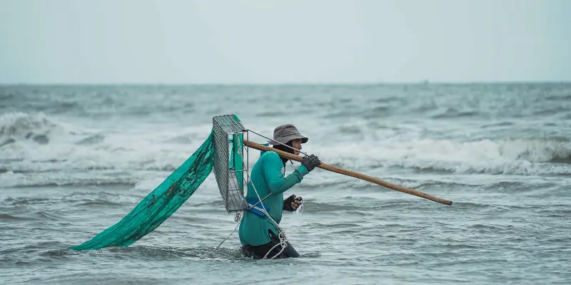 Modern depiction of a fisherman wearing a bucket-style hat
