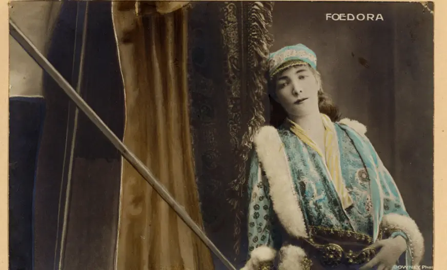 Sarah Bernhardt wearing a soft hat with center crease and front pinch in the 1882 play Fédora, origin of the fedora hat