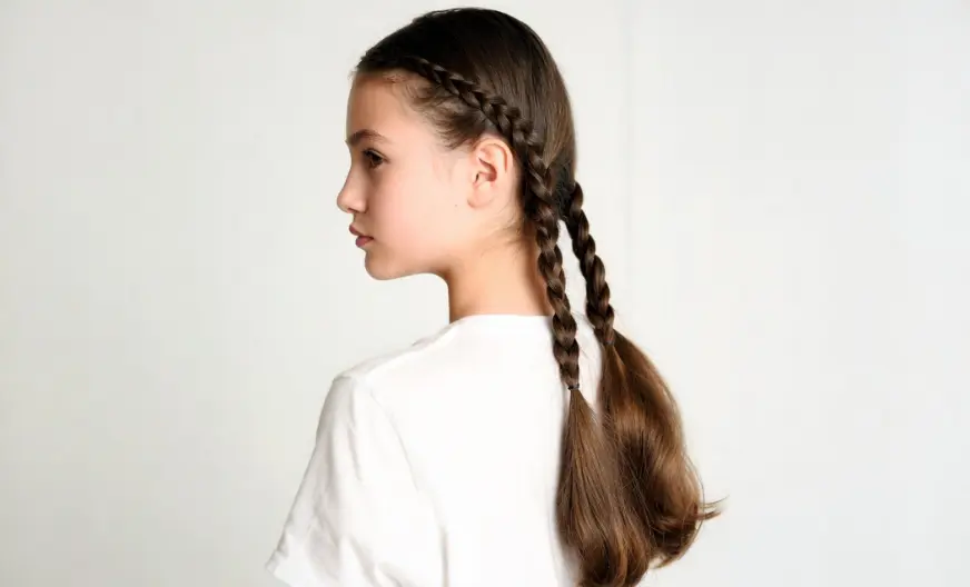 How to Wear a Hat with Long Hair Without Ruining Your Style 9 Elegant double braid hairstyle for long hair, side profile view against a white background.