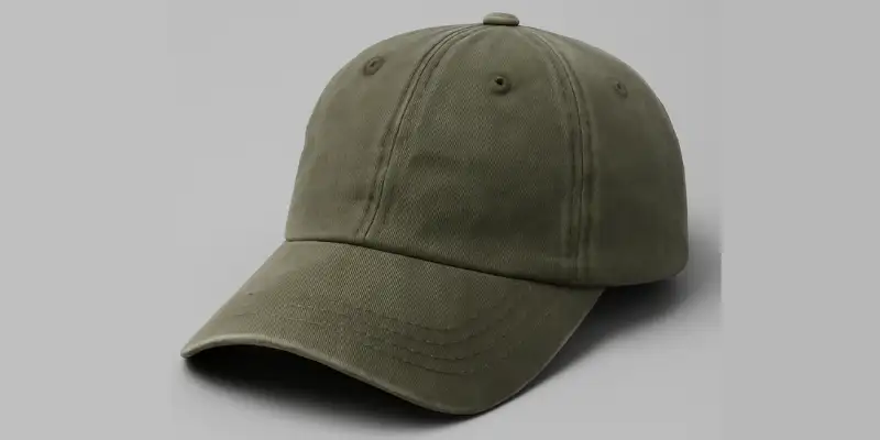 26 Different Types of Hats Explained (With Names, Styles & Pictures) 16 Olive green dad hat with curved brim on a plain background