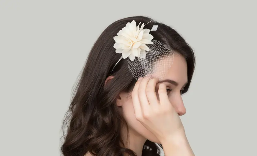 Adult woman wearing a small side fascinator paired with a casual outfit, relaxed hairstyle