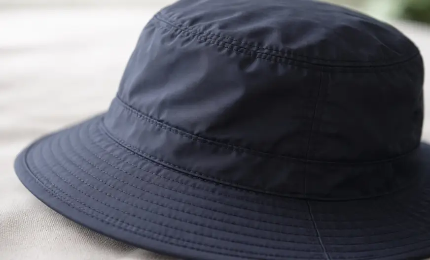 Hat Materials Explained: A Complete Guide to Choosing the Right Fabric 9 Close-up of a nylon hat showing smooth, water-resistant, lightweight fabric suitable for rain and travel.