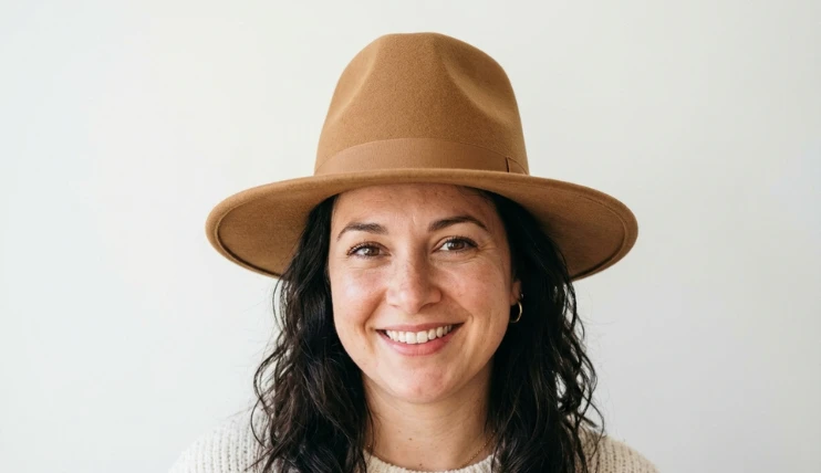 Home 12 Woman with a round face wearing a tall crown wide brim hat that makes her face look slimmer