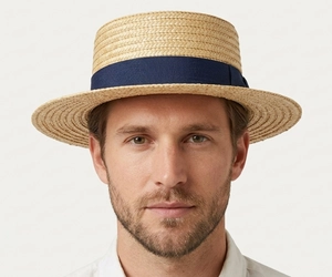 Man with an oval face wearing a straw boater hat with a medium wide brim showing why it is one of the best hats for oval faces with balanced shape and classic style