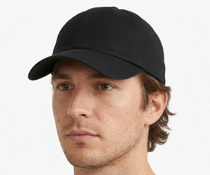 Human model with an oval face wearing a low-profile dad hat showing how it fits and balances the face shape