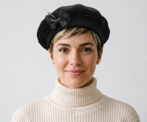 Woman with a pixie haircut wearing a classic French beret, solid color, perfect for pixie cut hairstyle
