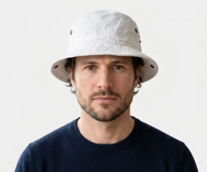 man with sqaure face wearing a boonie hat