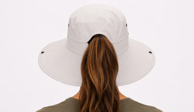 Best UPF Hats for Women (2026) 13 Back view of FURTALK Sun Hat showing ponytail opening with woman's hair through the hat
