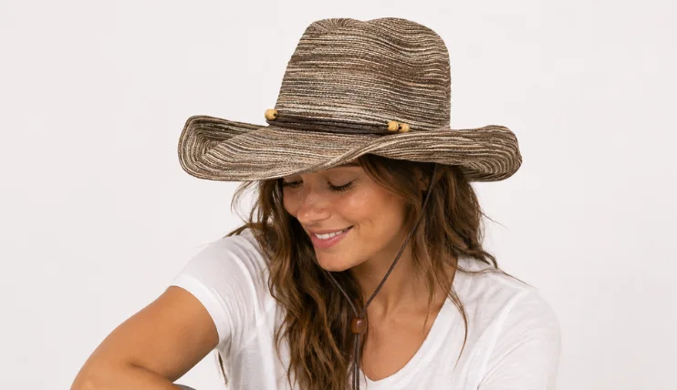 Best UPF Hats for Women (2026) 16 Woman wearing Sunday Afternoons Sunset Hat with wide shapeable brim and chin strap for UPF 50+ sun protection