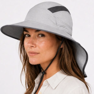 Woman wearing Sunday Afternoons Ultra Adventure Hat with wide brim and neck cape for UPF 50+ sun protection