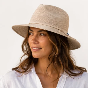 Woman wearing Wallaroo Victoria Fedora beige packable sun hat with wide brim