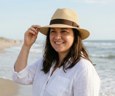 Woman wearing a straw panama fedora